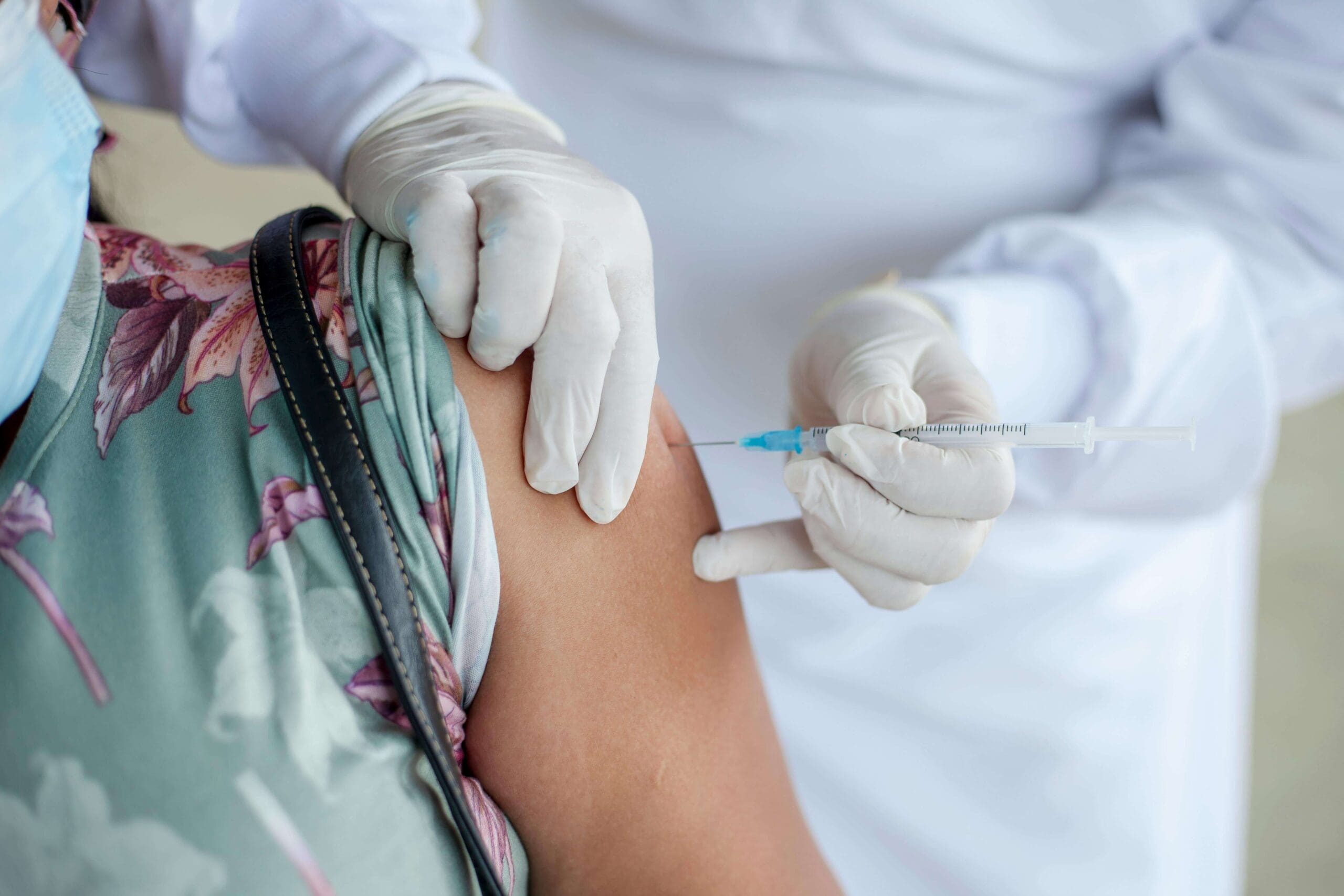 Adult receiving an immunization in the arm