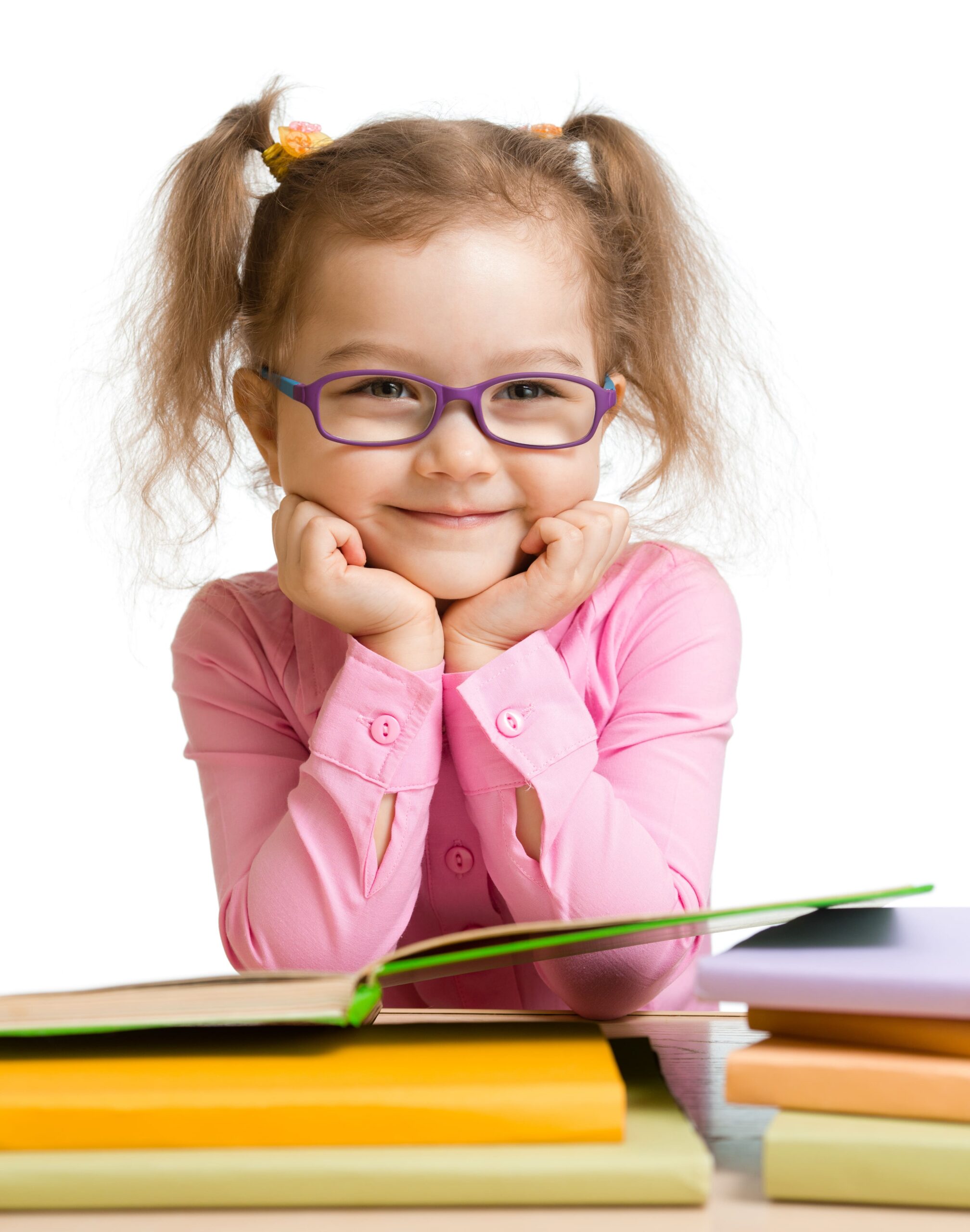 Girl wearing reading glasses and smiling while holding books